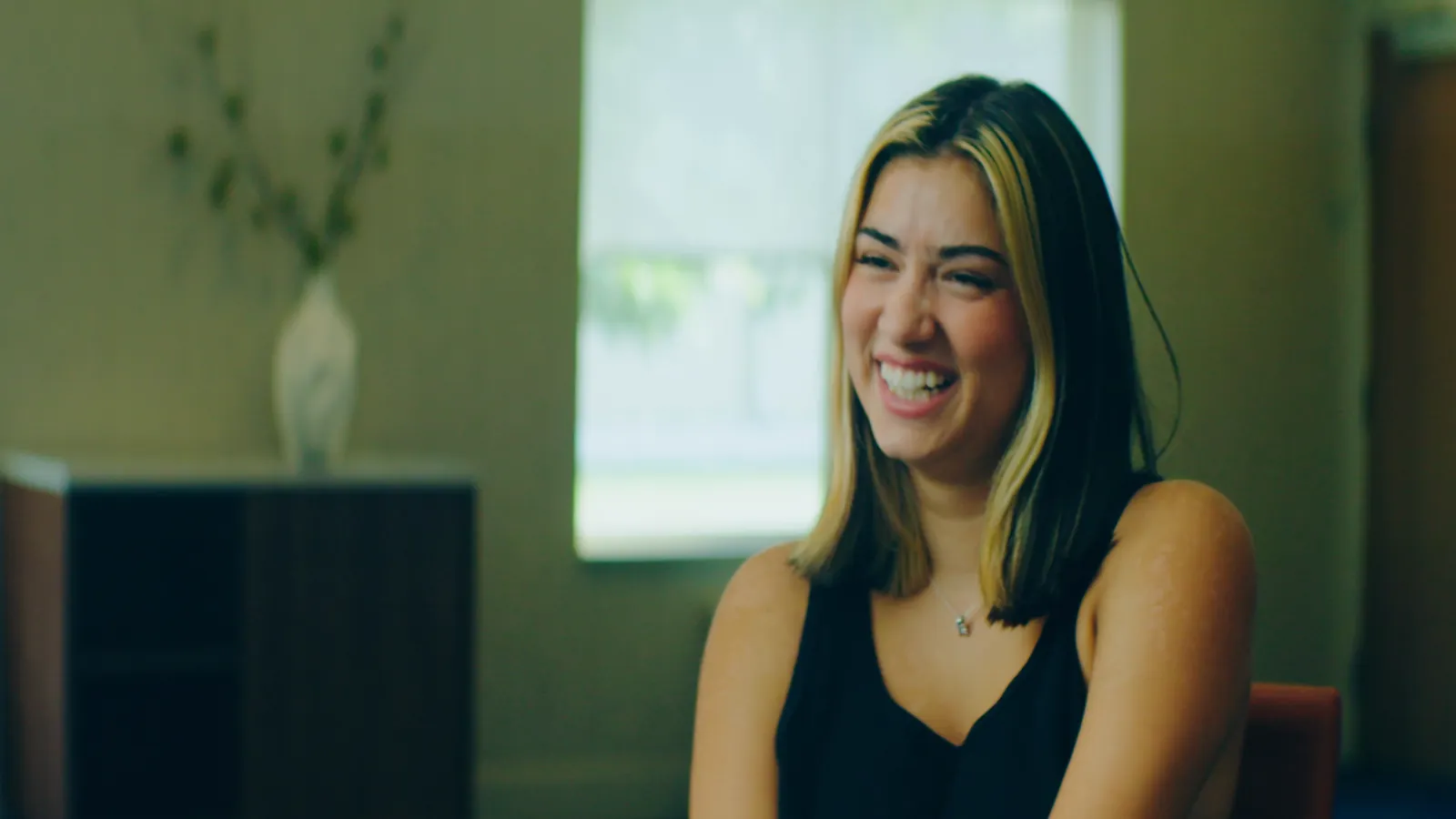 A portrait of a person mid conversation
