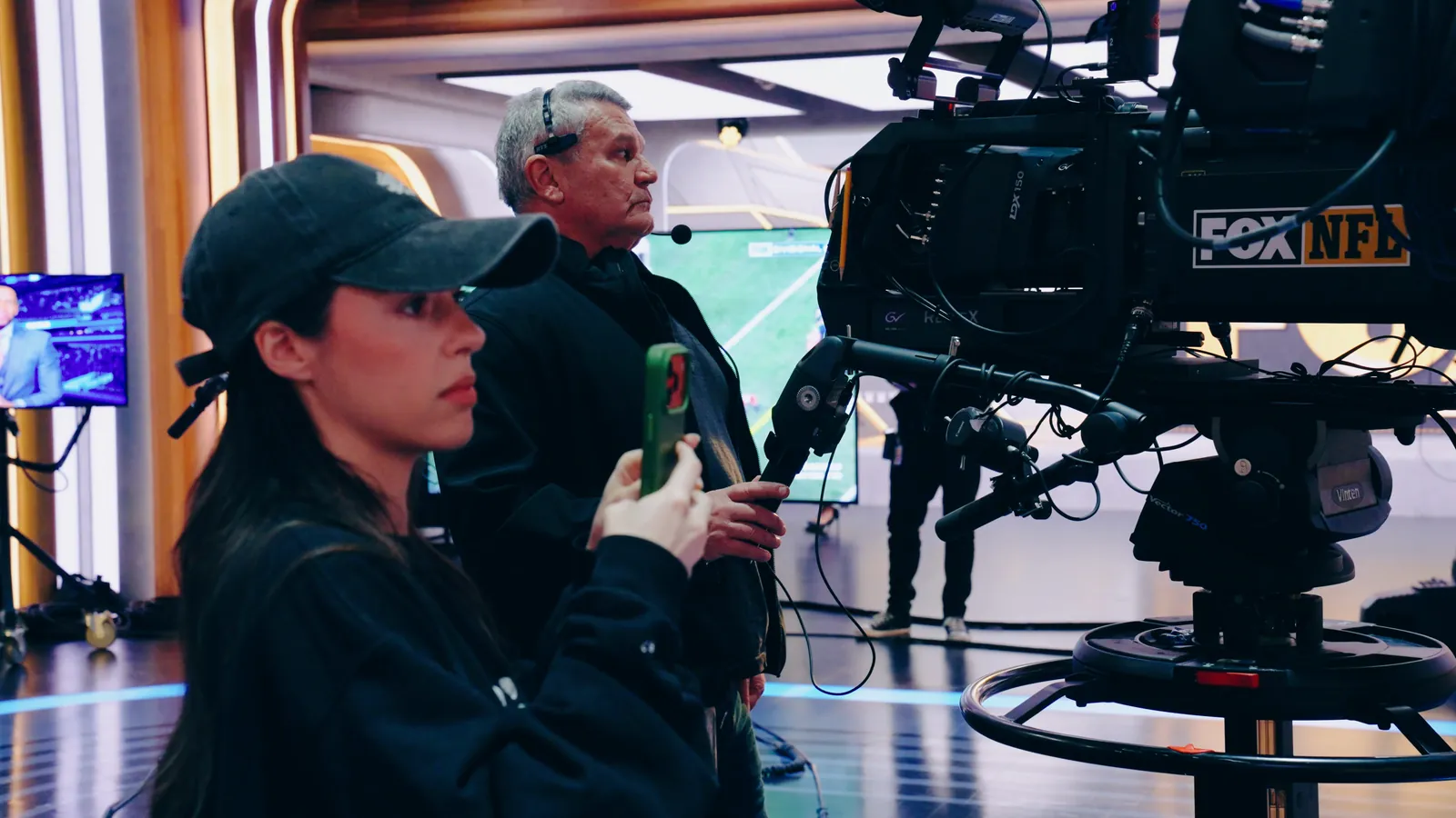A broadcast studio set inside a stadium